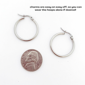 20 mm stainless steel hoop earrings sized next to a nickel