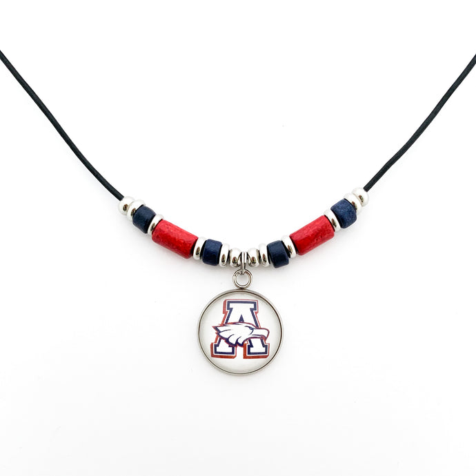 custom stainless steel Allen Eagles high school logo pendant with red and navy beads and stainless steel spacers beads on a black leather cord