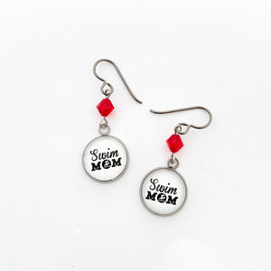 stainless steel swim mom charm earrings with red swarovski crystal bead accents