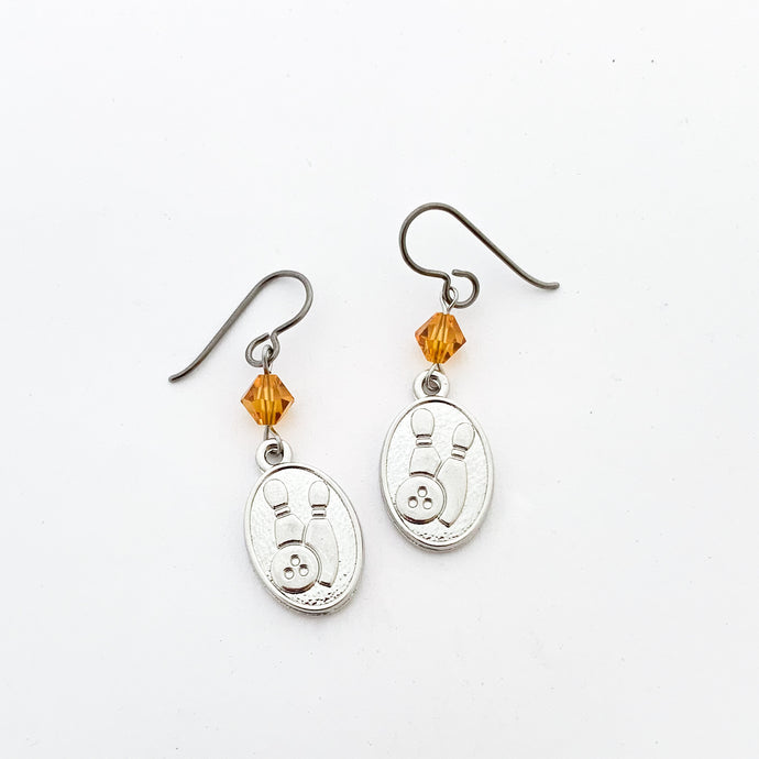 silver embossed bowling charm earrings with topaz Swarovski crystal bicone beads