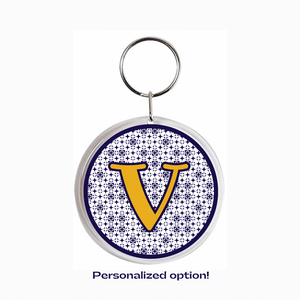 personalized acrylic photo keychain with yellow capital "V" and blue pattern background