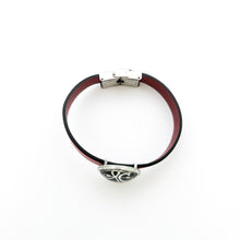 top view of a red leather cuff bracelet with stainless steel slide charm and stainless steel clasp