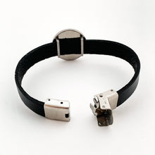back view of black leather strap bracelet with stainless steel slide charm and open clasp