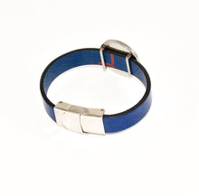 back view of blue leather strap bracelet with stainless steel slide charm and clasp