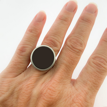 close up of female wearing stainless steel and black statement ring