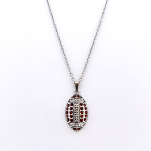 silver allow football pendant with brown rhinestones on a stainless steel curb chain