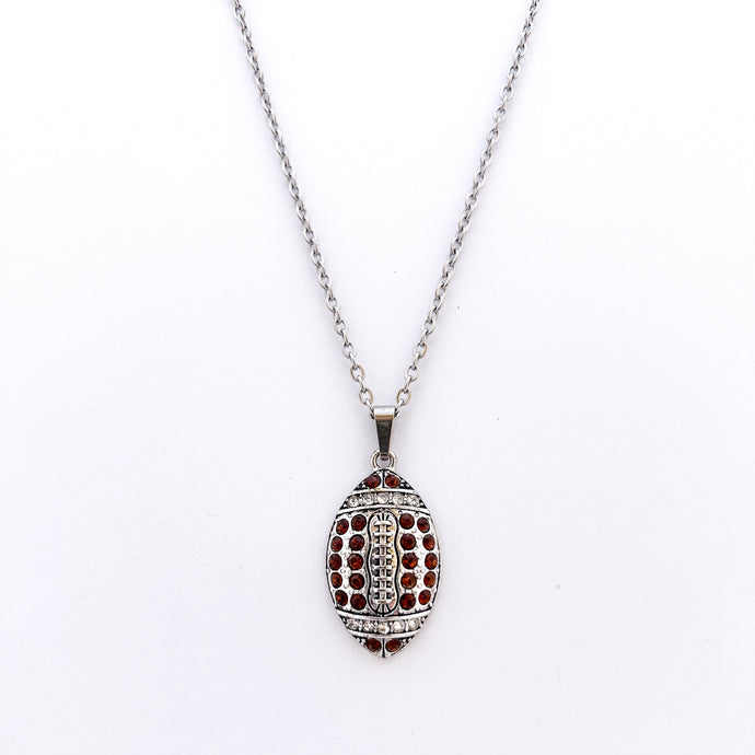 silver allow football pendant with brown rhinestones on a stainless steel curb chain