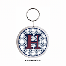 acrylic Keychain with maroon letter 'H' with navy blue design
