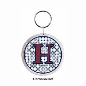 acrylic Keychain with maroon letter 'H' with navy blue design