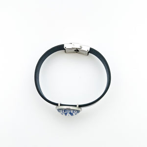 top view of blue leather cuff bracelet with closed stainless steel clasp