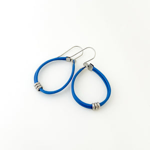 blue leather cord hoop earrings with stainless steel accents and titanium ear wires