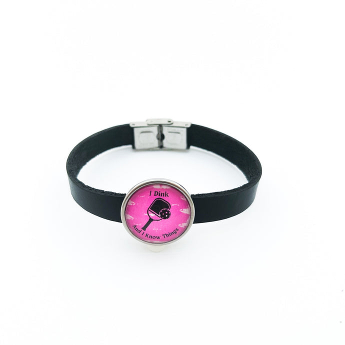 black leather cuff bracelet with stainless steel pickleball slide charm in pink I Dink graphic