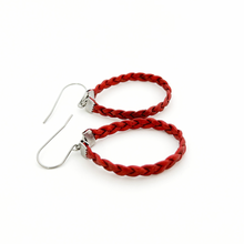 pair of red braided leather hoop earrings on titanium ear wires