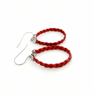 pair of red braided leather hoop earrings on titanium ear wires