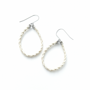 pair of white braided leather hoop earrings on titanium ear wires