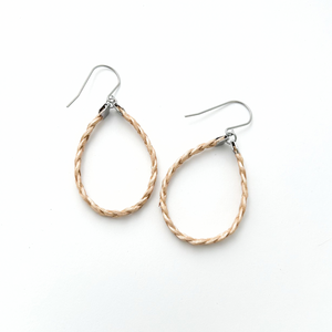 pair of metallic yellow braided leather hoop earrings on titanium ear wires