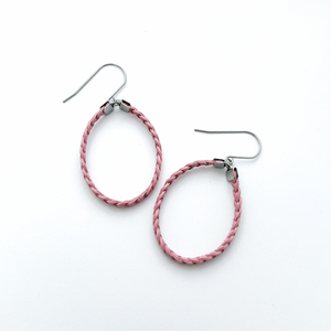 pair of pink braided leather hoop earrings on titanium ear wires