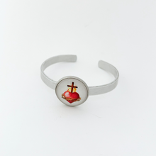 aluminum cuff bracelet with a sacred heart graphic
