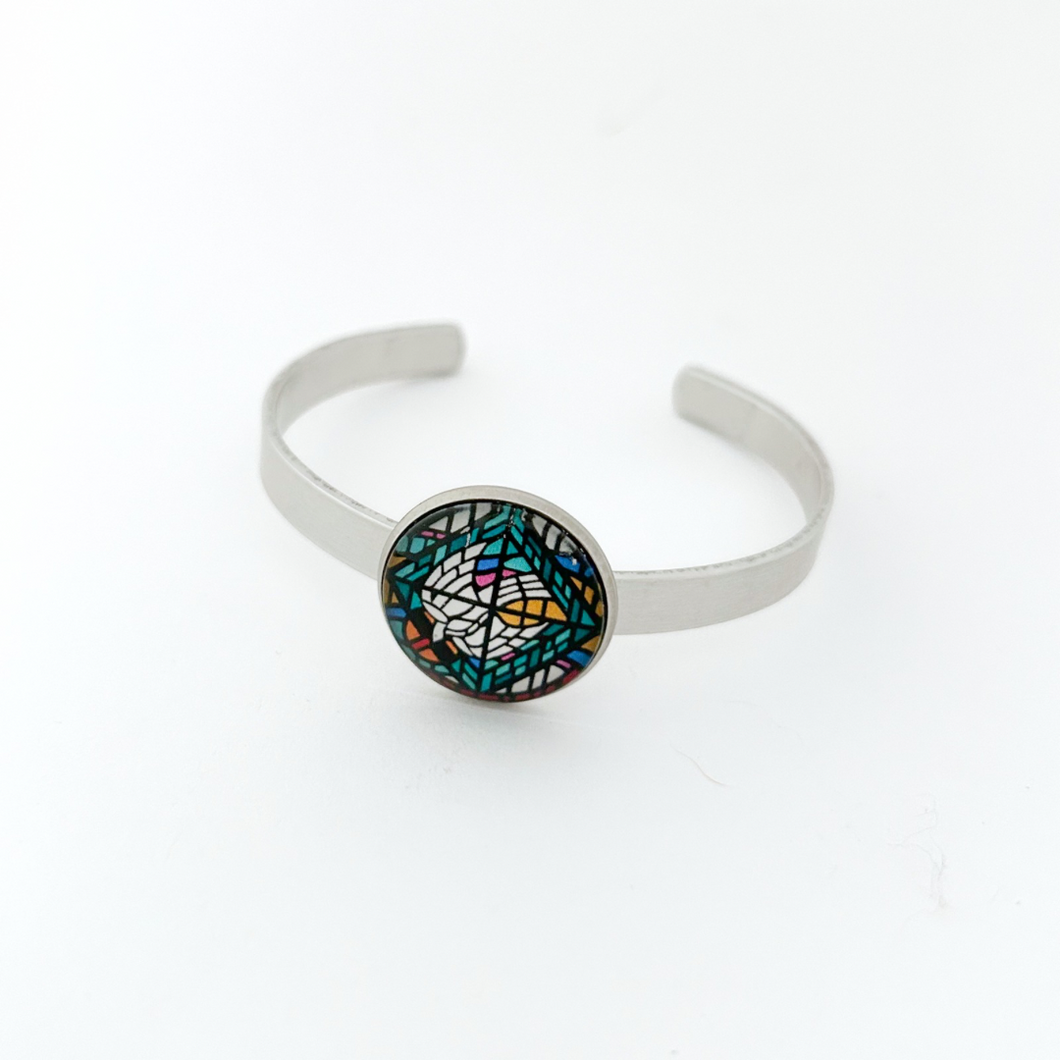 aluminum cuff bracelet with a stained glass dove holy spirit graphic