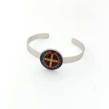 aluminum cuff bracelet with a St. Benedict graphic logo