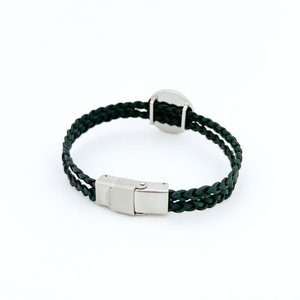 Back view of a green braided leather bracelet with stainless steel clasp and stainless steel slide charm