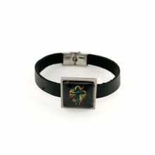 Black leather bracelet with a square charm featuring a cross design on a white background