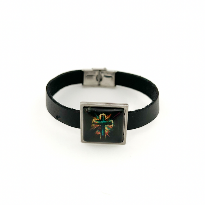 Black leather bracelet with a square charm featuring a cross design on a white background
