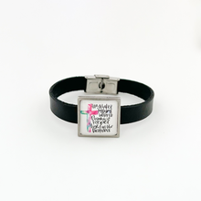 black leather bracelet featuring christian graphic slide charm and stainless steel clasp