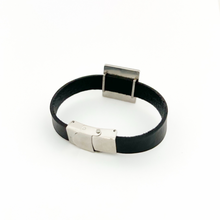 back view of black leather cuff bracelet with stainless steel square slide charm and stainless steel clasp