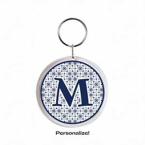 2.25" round acrylic Keychain with letter 'M' in navy blue on a navy blue and white patterned background