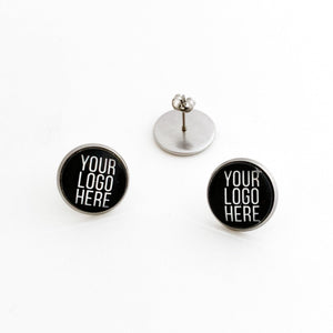 Black round stud earrings with 'Your Logo Here' text on a white background