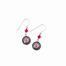Pair of earrings with circular Chattooga Choir  charms, red Swarovski crystal beads, and silver titanium ear wires