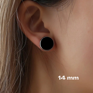 close up of young female wearing 14mm stud earrings