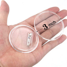 3.0" acrylic round photo button in the palm of a man's hand