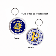 Two-sided keychain with the Olmsted falls bulldogs logo on one side and a yellow letter 'B' on the other with navy blue pattern background