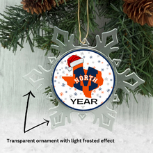 Decorative Christmas ornament with a transparent design featuring 'McKinney NORTH logo and YEAR' text and a Santa hat on a green wreath background.