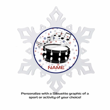 Acrylic Snowflake-shaped ornament with a holiday themed graphic of a drum and musical notes in the center and personalized text for name