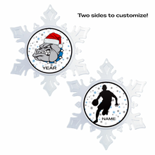 Two snowflake-shaped customizable ornaments with a holiday themed Belgreen bulldog logo on one side and a male silhouette basketball player with personalized text on the other side