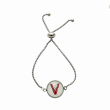 stainless steel adjustable bracelet with a circular center charm featuring the Vines High School Band V logo