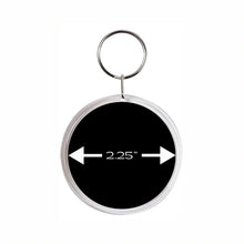 acrylic round keychain with a 2.25" measurement arrow on a black background