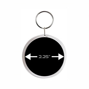 acrylic round keychain with a 2.25" measurement arrow on a black background