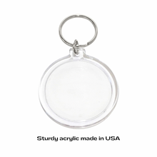 Clear acrylic keychain on a white background with text 'Sturdy acrylic made in USA'.