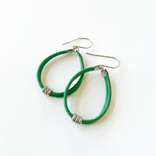 green leather cord hoop earrings with stainless steel accents and titanium ear wires