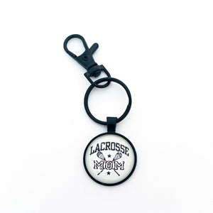 1-inch black "Lacrosse Mom" keychain with matching swivel clip