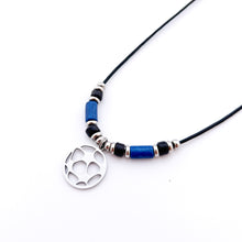stainless steel soccer pendant necklace with blue and black ceramic tube beads and stainless steel spacers strung on a black leather cord