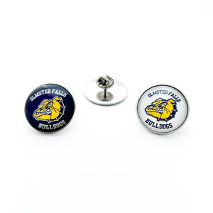 pair of two stainless steel round brooch pins with the Olmsted Falls Bulldogs logos one with blue background and one with white background