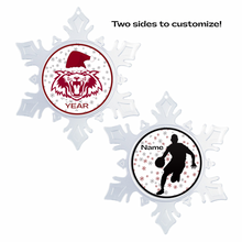 front and back view of an acrylic snowflake shaped ornament with a holiday themed vines high school wildcat graphic in the center on one side and a sports silhouette graphic with coordinating snowflakes on the other side