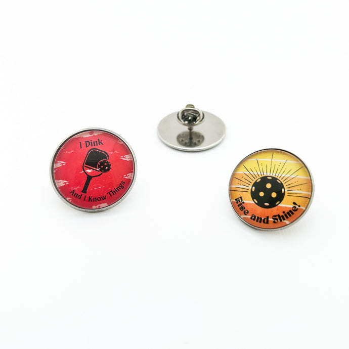 stainless steel pickleball brooch pins with red I Dink and Rise and Shine graphics 
