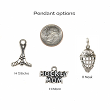silver hockey sticks, hockey mom, and hockey mask charms
