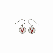 circular charm earrings with the vines v logo attached to titanium ear wires